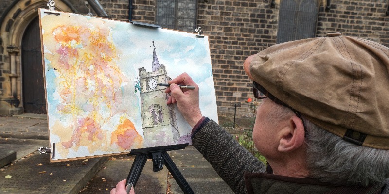 Martin Williamson painting the church